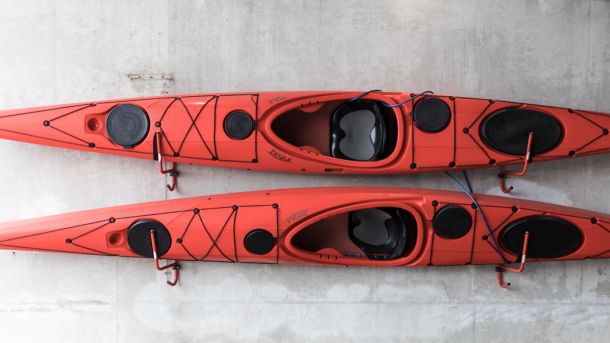 two kayaks stored on wall 00a87252