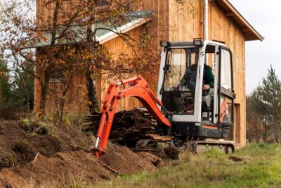 small rental excavator digging trench 6cc7890a