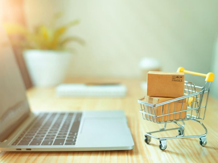 small cart in front of laptop e27efa0e